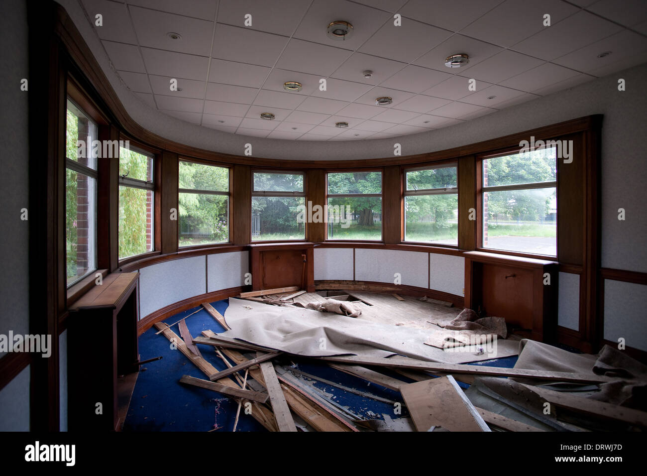 A trashed semicircular office room Stock Photo