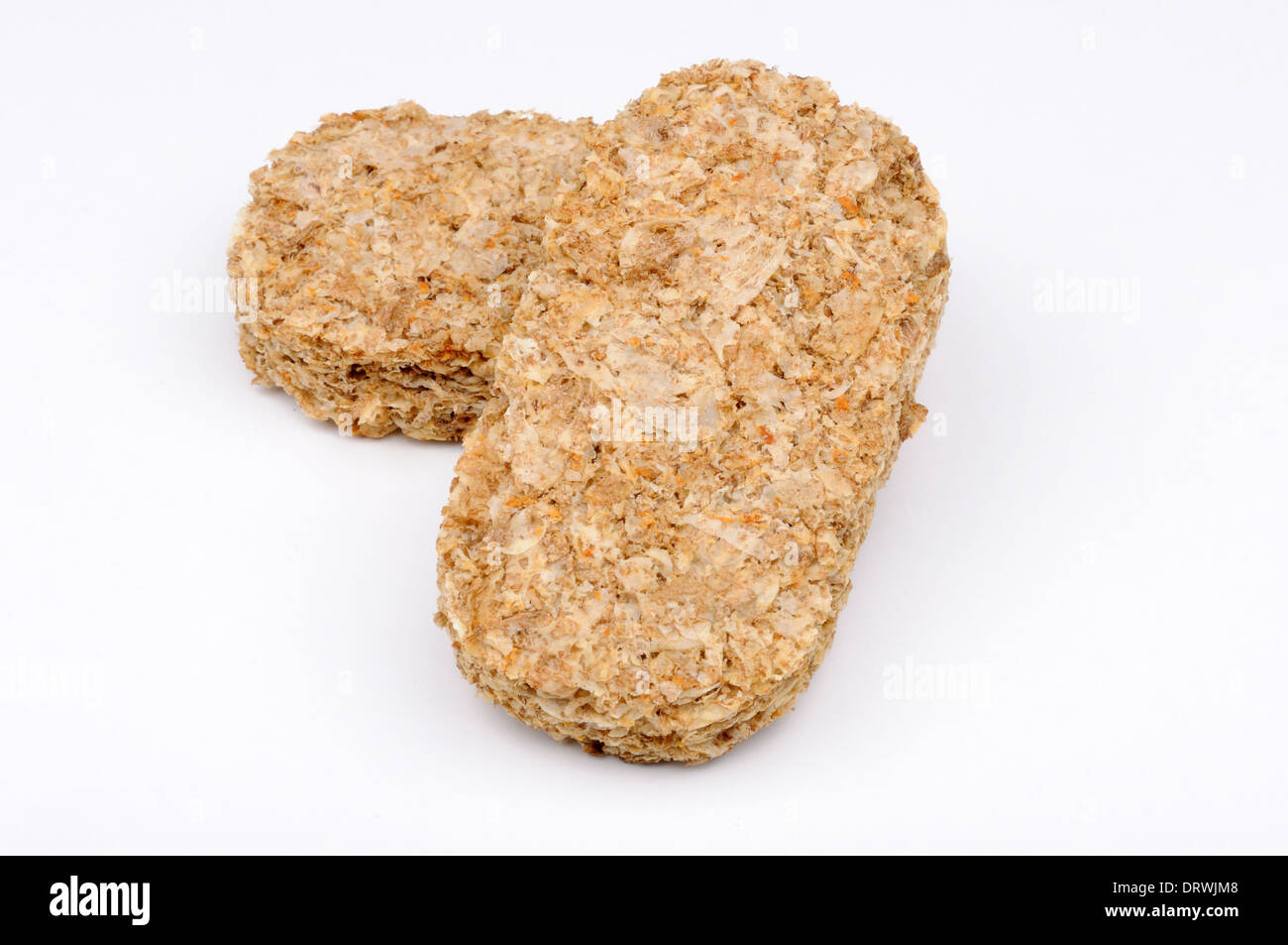 Two wholegrain wheat biscuits on a white background Stock Photo