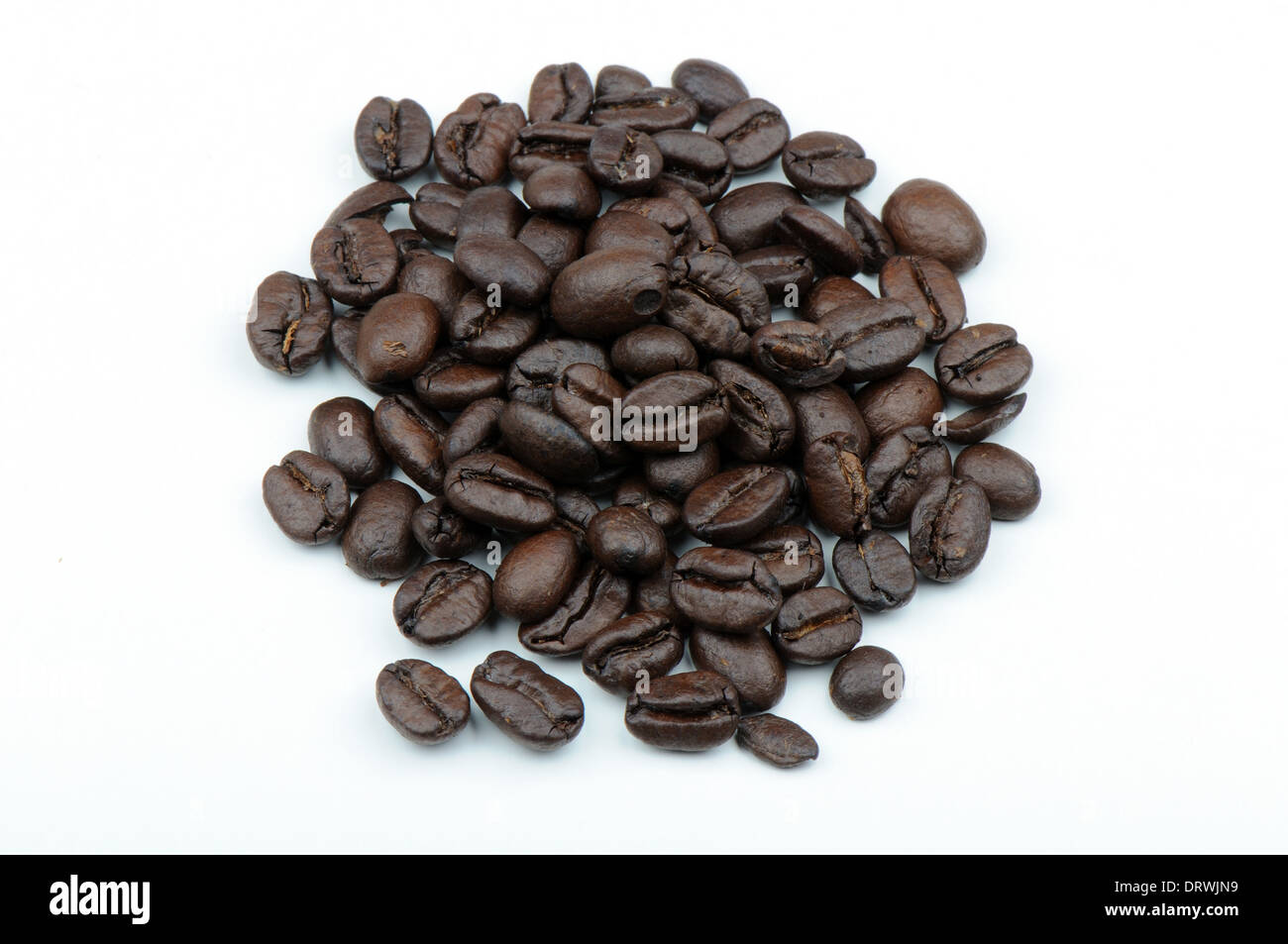 Coffee beans on neutral background. Stock Photo