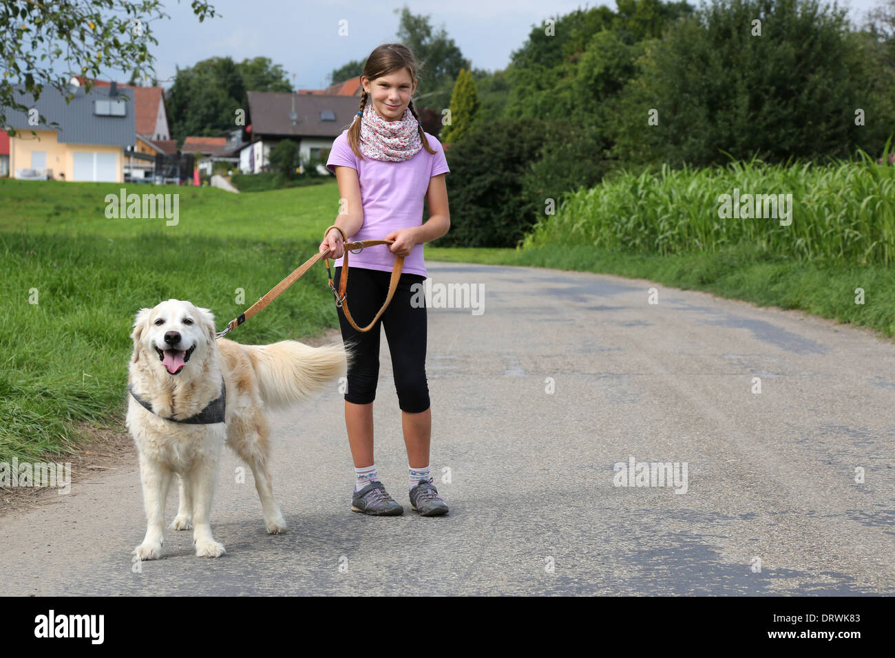 Little girl and her dog outdoors in nature Stock Photo - Alamy
