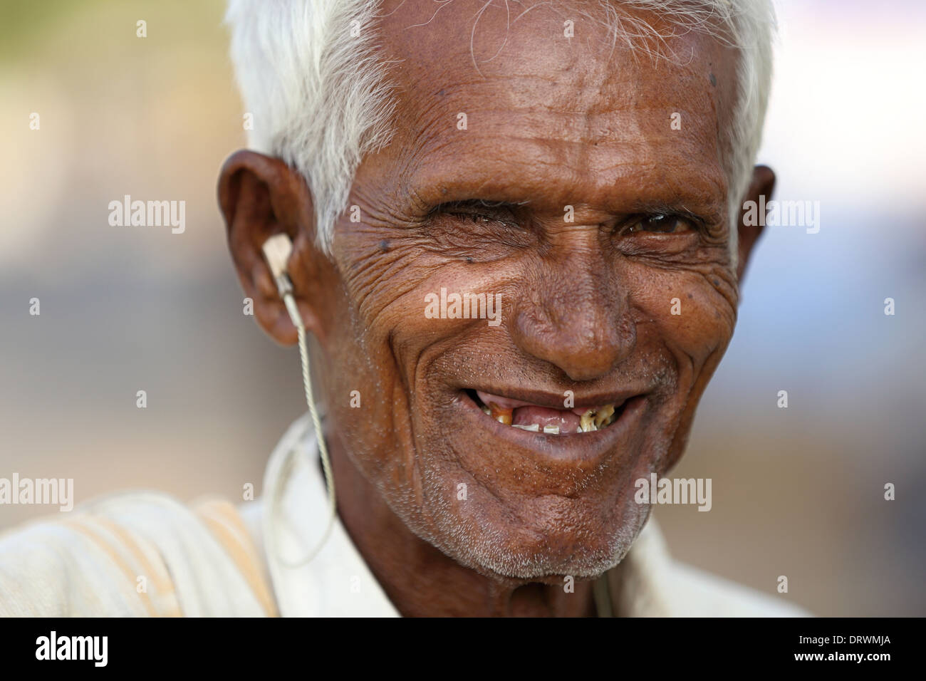 Old Indian man with hearing aid Stock Photo
