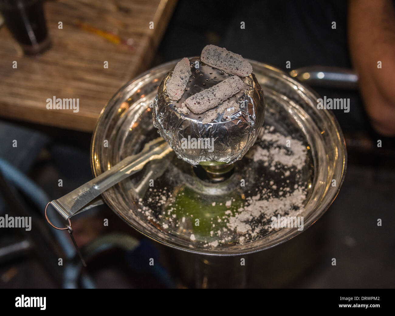 coals on a shisha A hookah (Arabic حقہ‎, ḥuqqah, hukkā, Hukić, ‒ also