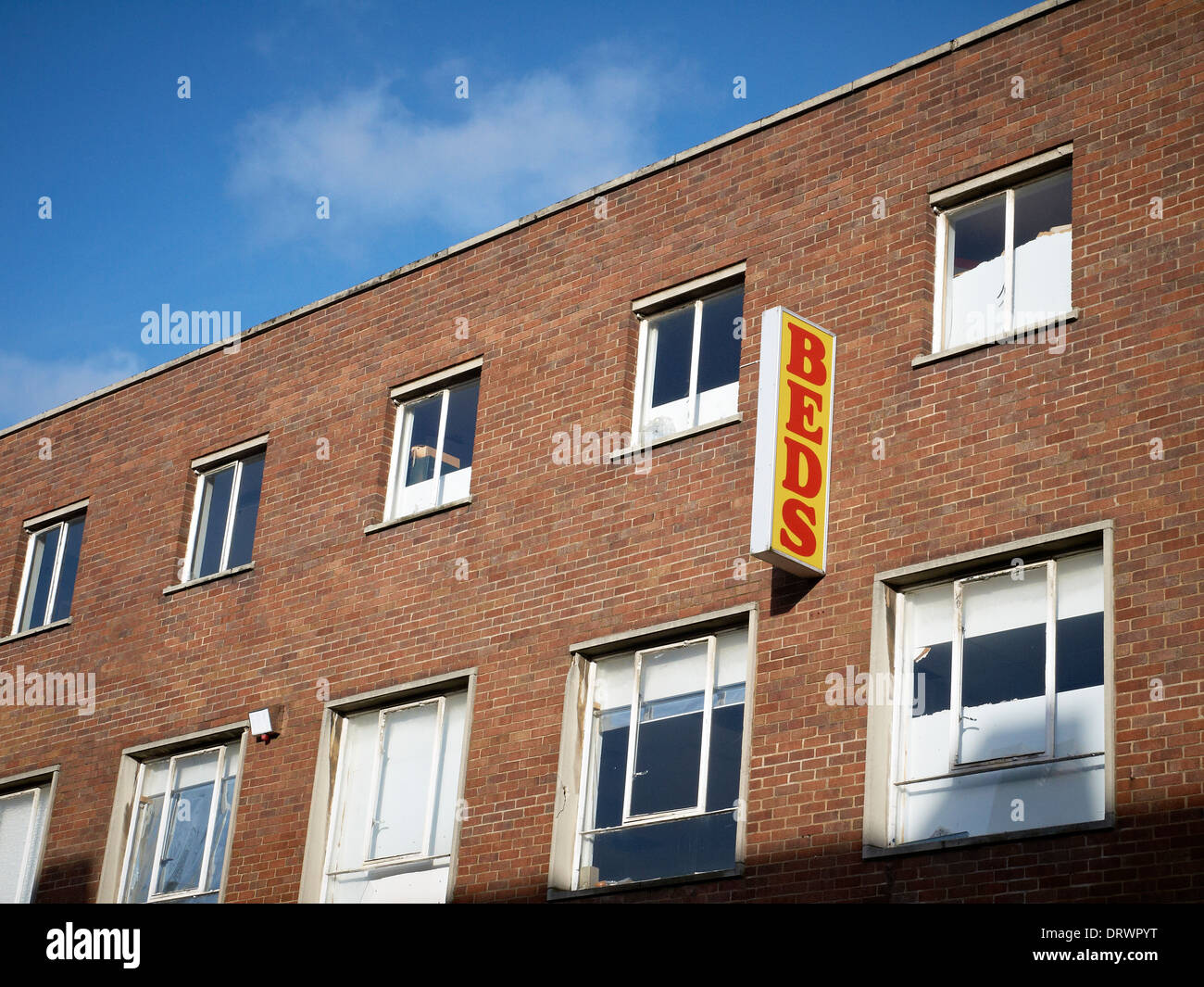 Beds sign on external wall in Crewe Cheshire UK Stock Photo