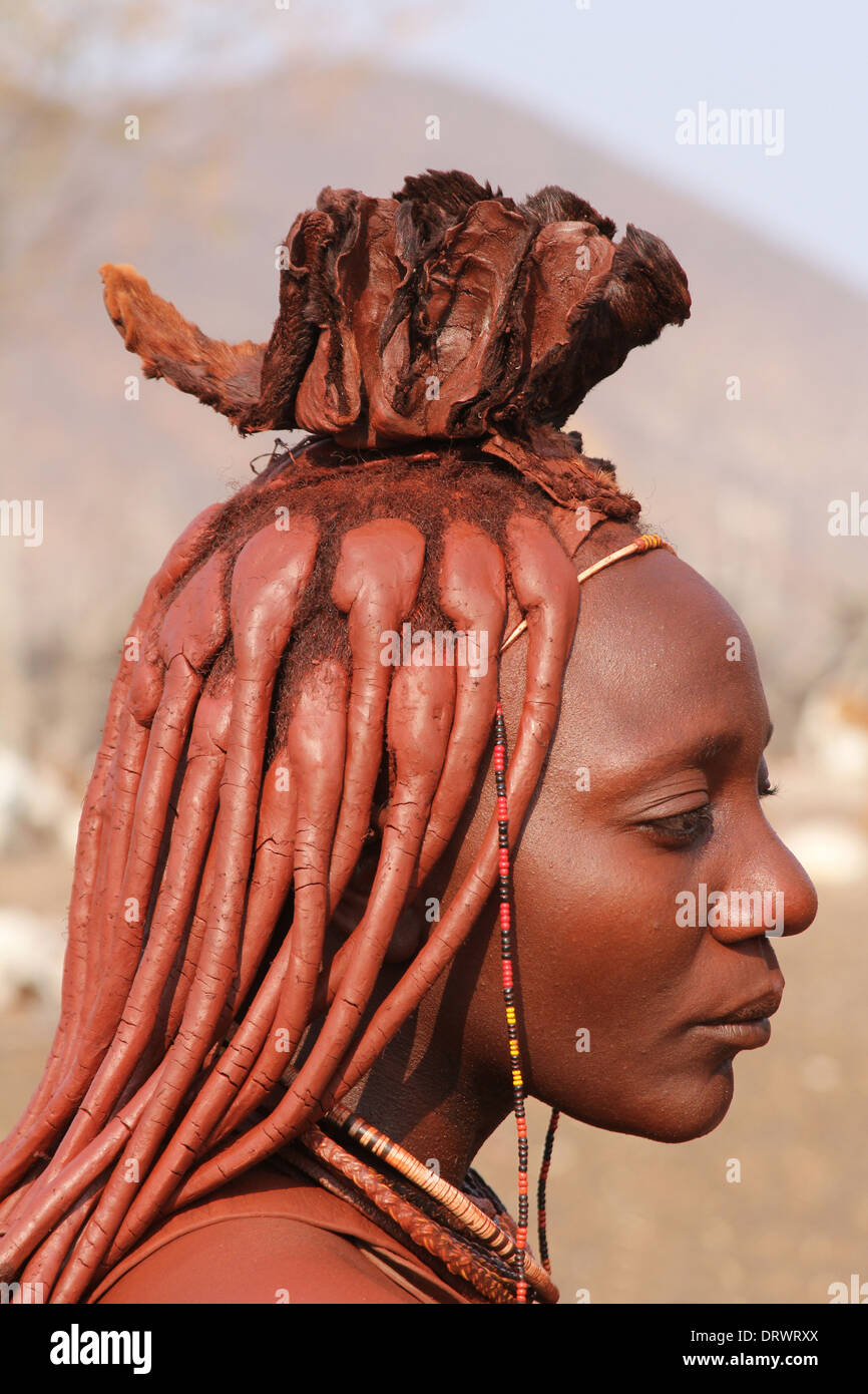 Profile of beautiful Himba woman with the traditional ochre and mud,decorated, ,and braided hairstyle of the Himba tribe,Namibia Stock Photo