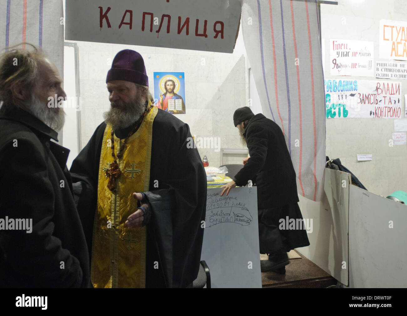 Kiev, Ukraine. 03rd Feb, 2014. The International Convention Center, better known as Ukrainian House, has been occupied by EuroMaidan protesters since 26th January, 2014. A library, conference hall, chapel, and place to sleep, have been created inside the building. Priests of protesters' chapel in Ukrainian House. Credit:  Oleksandr Rupeta/Alamy Live News Stock Photo