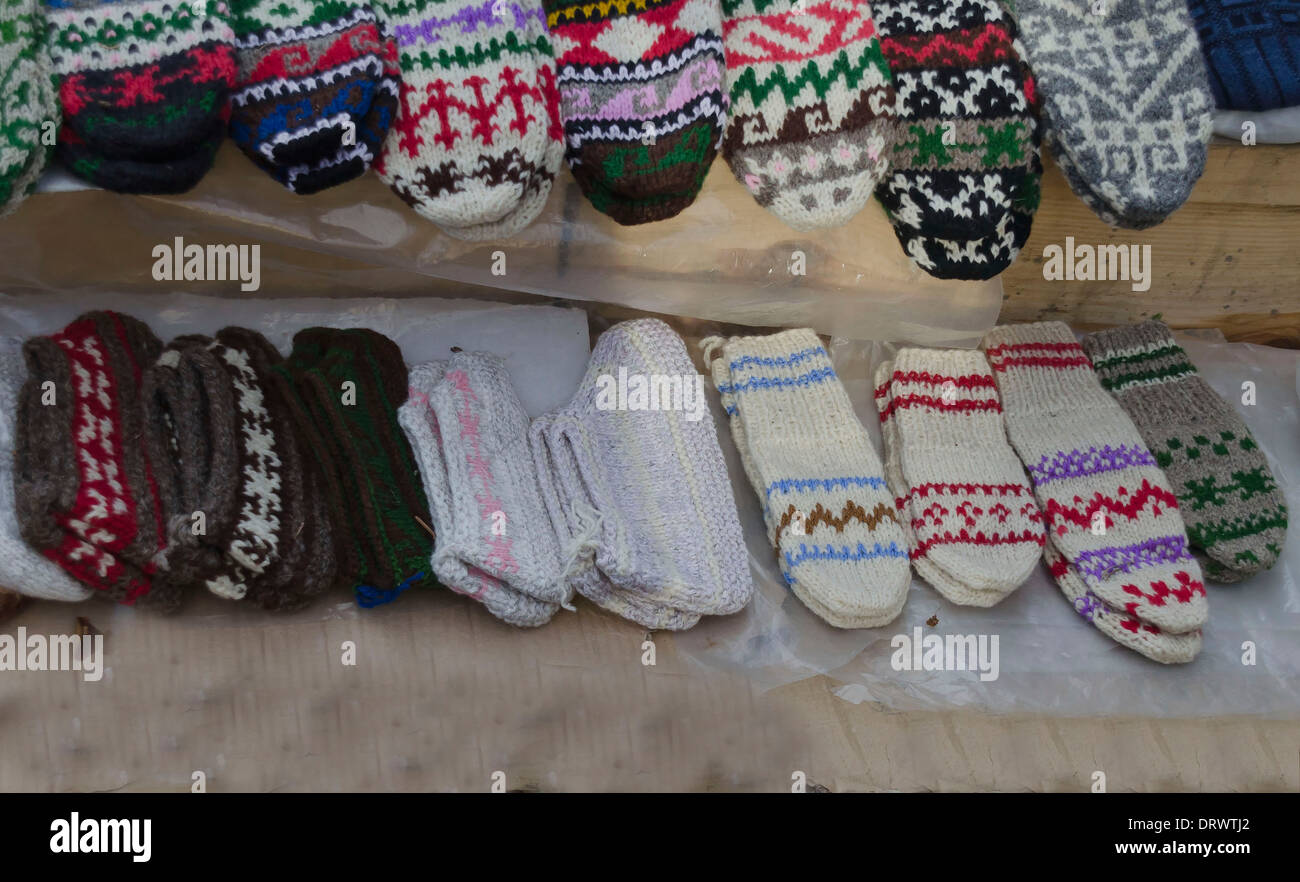 Traditional bulgarian colourful wool bootee and stocking knitted by hand Stock Photo