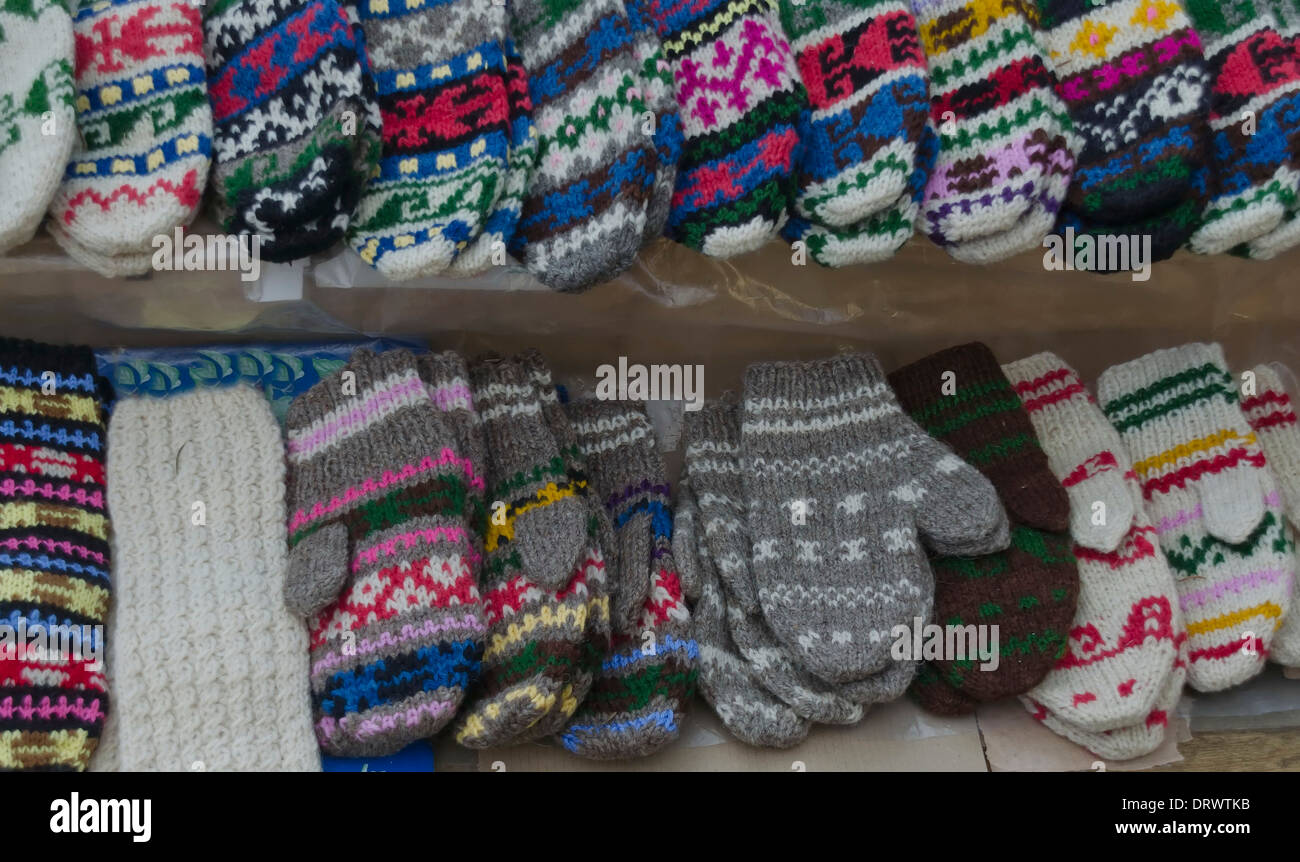 Traditional bulgarian colourful wool mittens and stockings knitted by hand Stock Photo