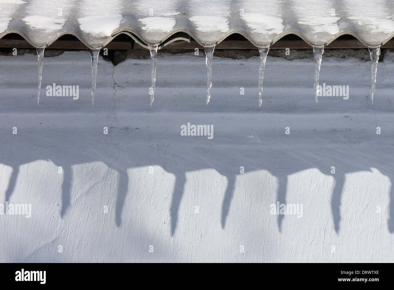 icicles on roof of building Stock Photo - Alamy