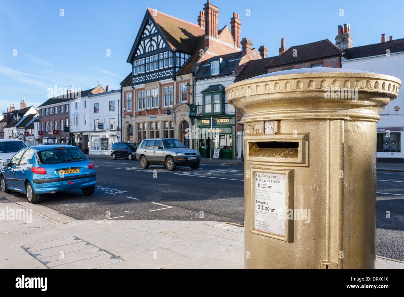 Gold painted pillar box marking the success of Team GB rowing, Henley-on-Thames, Oxfordshire, England, GB, UK. Stock Photo