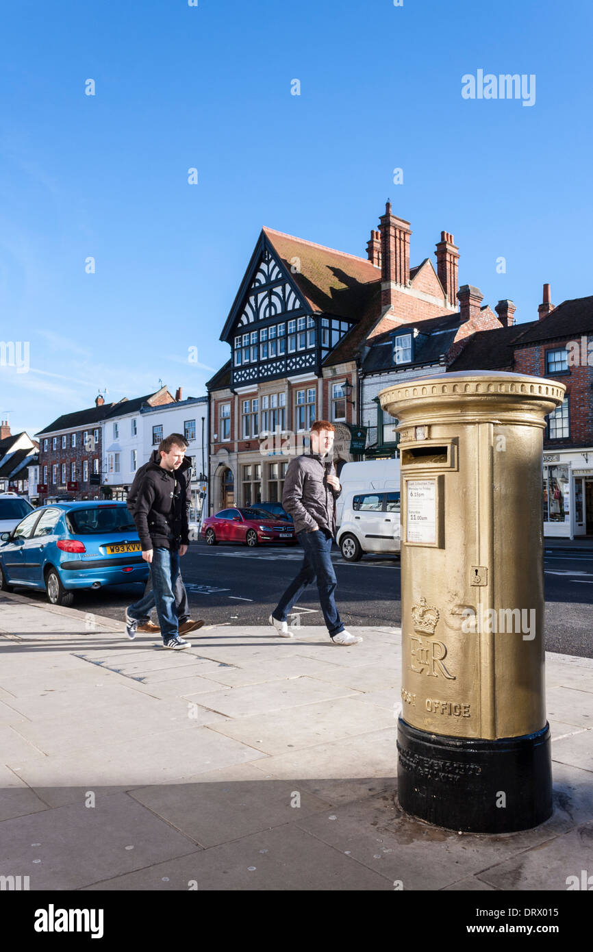 Gold painted pillar box marking the success of Team GB rowing, Henley-on-Thames, Oxfordshire, England, GB, UK. Stock Photo