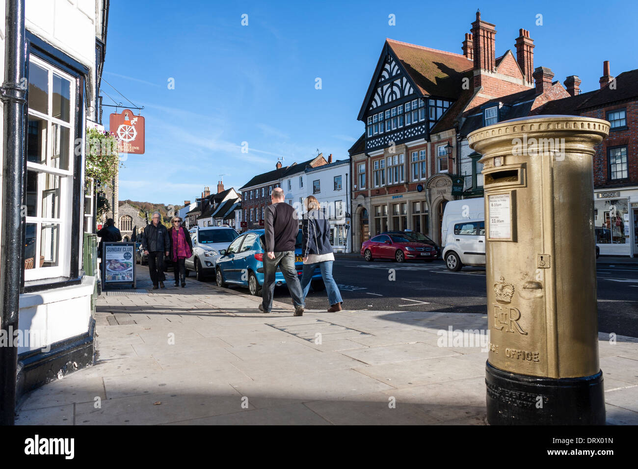 Gold painted pillar box marking the success of Team GB rowing, Henley-on-Thames, Oxfordshire, England, GB, UK. Stock Photo