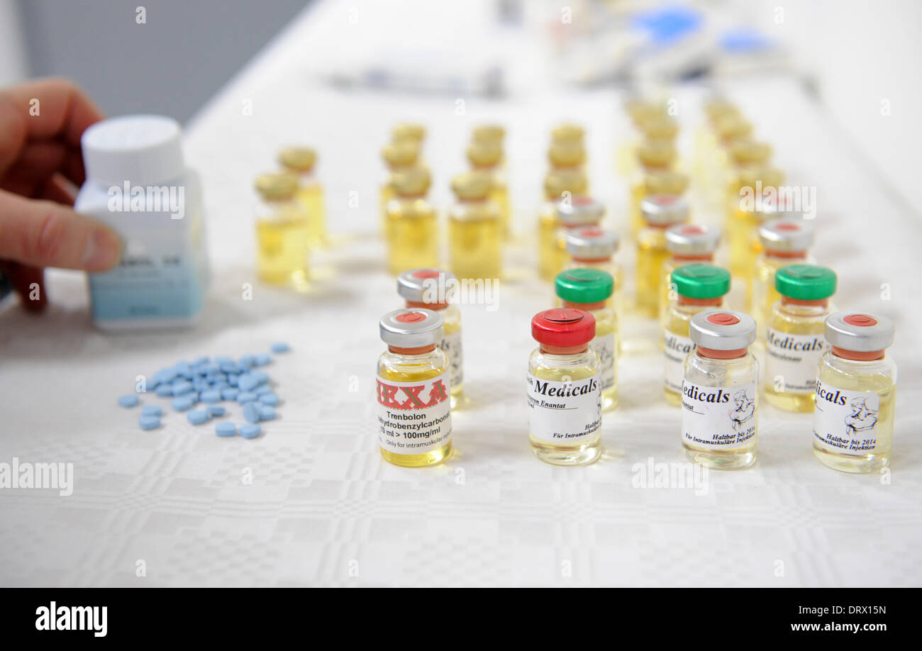 Munich, Germany. 03rd Feb, 2014. Bottles of anabolic steroids stand on a table during a press conference by the public prosecutor's office in Munich, Germany, 03 February 2014. The public prosecutor's office and the Bavarian Minister of Justice presented performance-enhancing drugs and a draft for a new Bavarian anti-doping-law. Photo: ANDREAS GEBERT/DPA/Alamy Live News Stock Photo