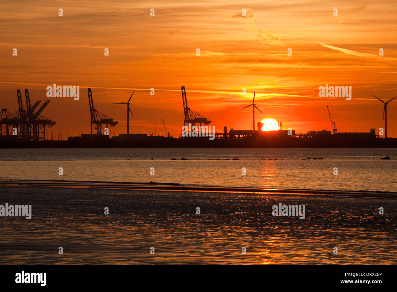 View from the beach of Duinbergen, Knokke-Heist on the port of Zeebrugge by evening. Photo V.D. Stock Photo