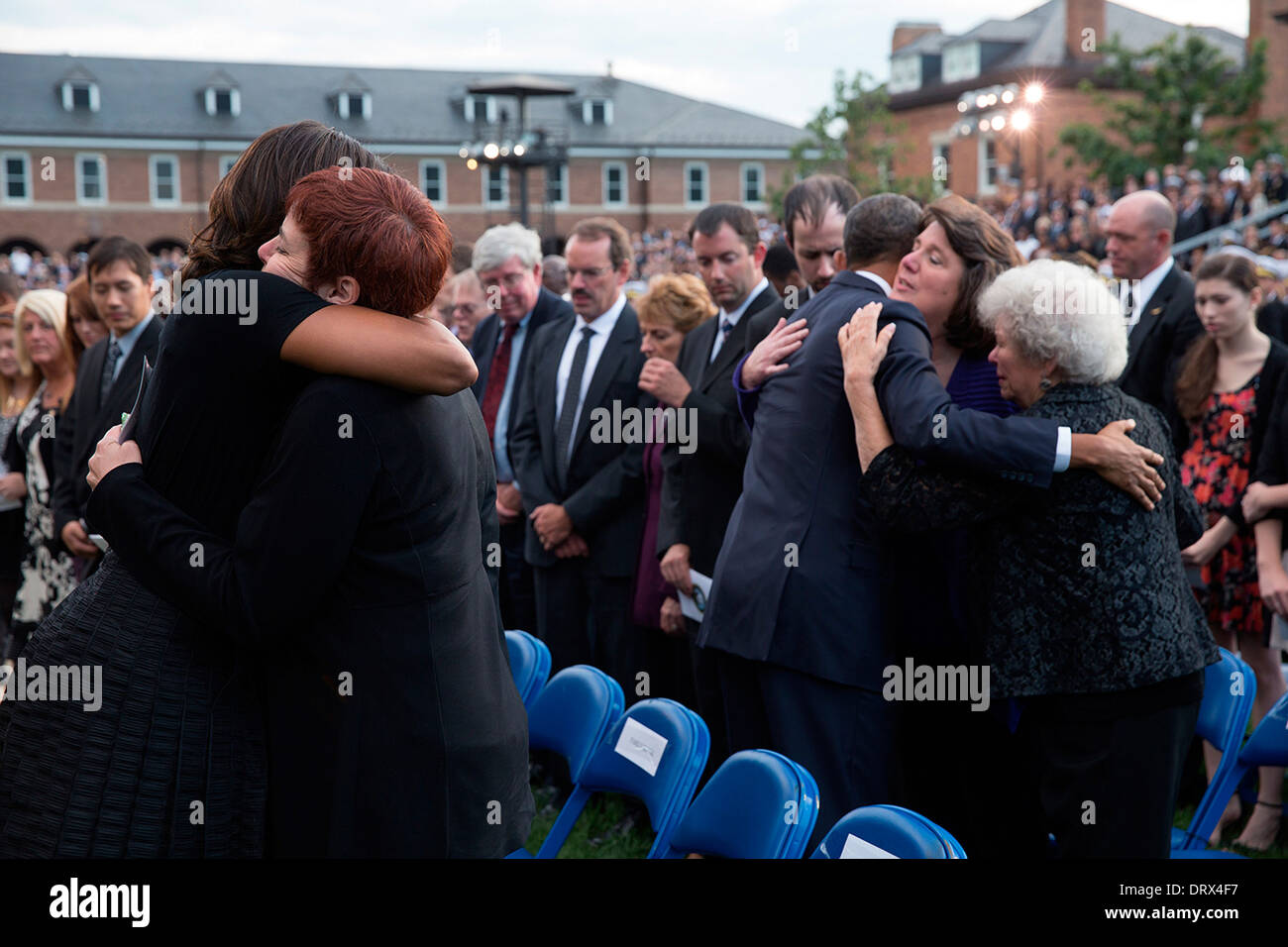 US President Barack Obama and First Lady Michelle Obama greet family members during a memorial service for victims of the Washington Navy Yard shootings at the Parade Grounds, Marine Barracks September 22, 2013 in Washington, DC. Stock Photo