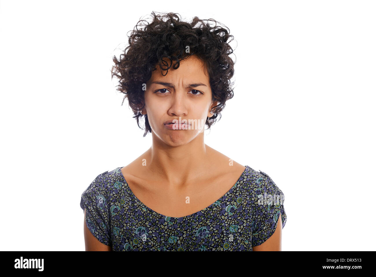portrait of hispanic woman looking at camera upset and sad. Isolated on white background Stock Photo