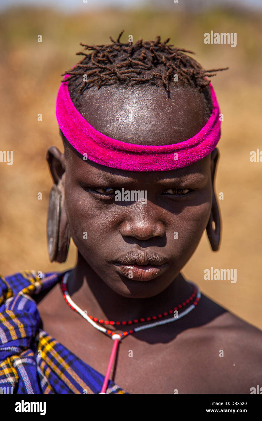 Portrait Of A Mursi Girl, Mursi Tribal Village, The Omo Valley, Ethiopia Stock Photo