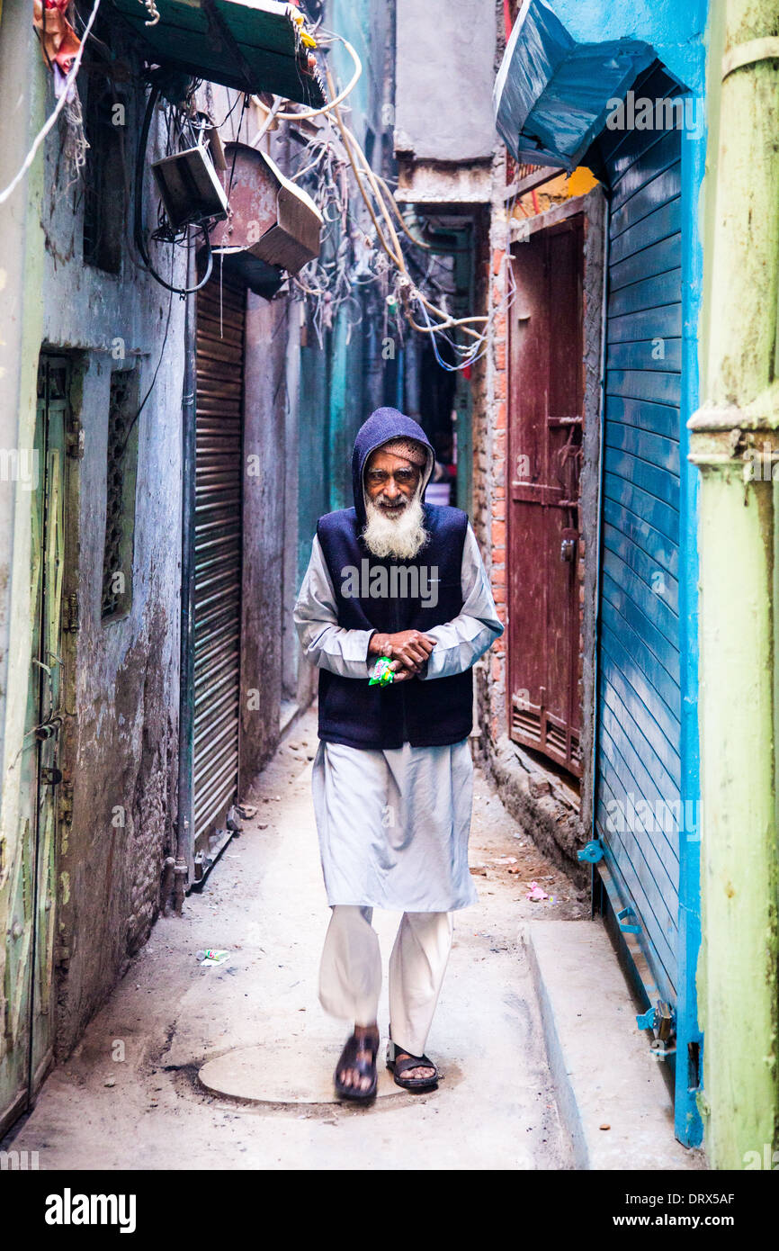 Old man in an alley in Old Delhi, India Stock Photo