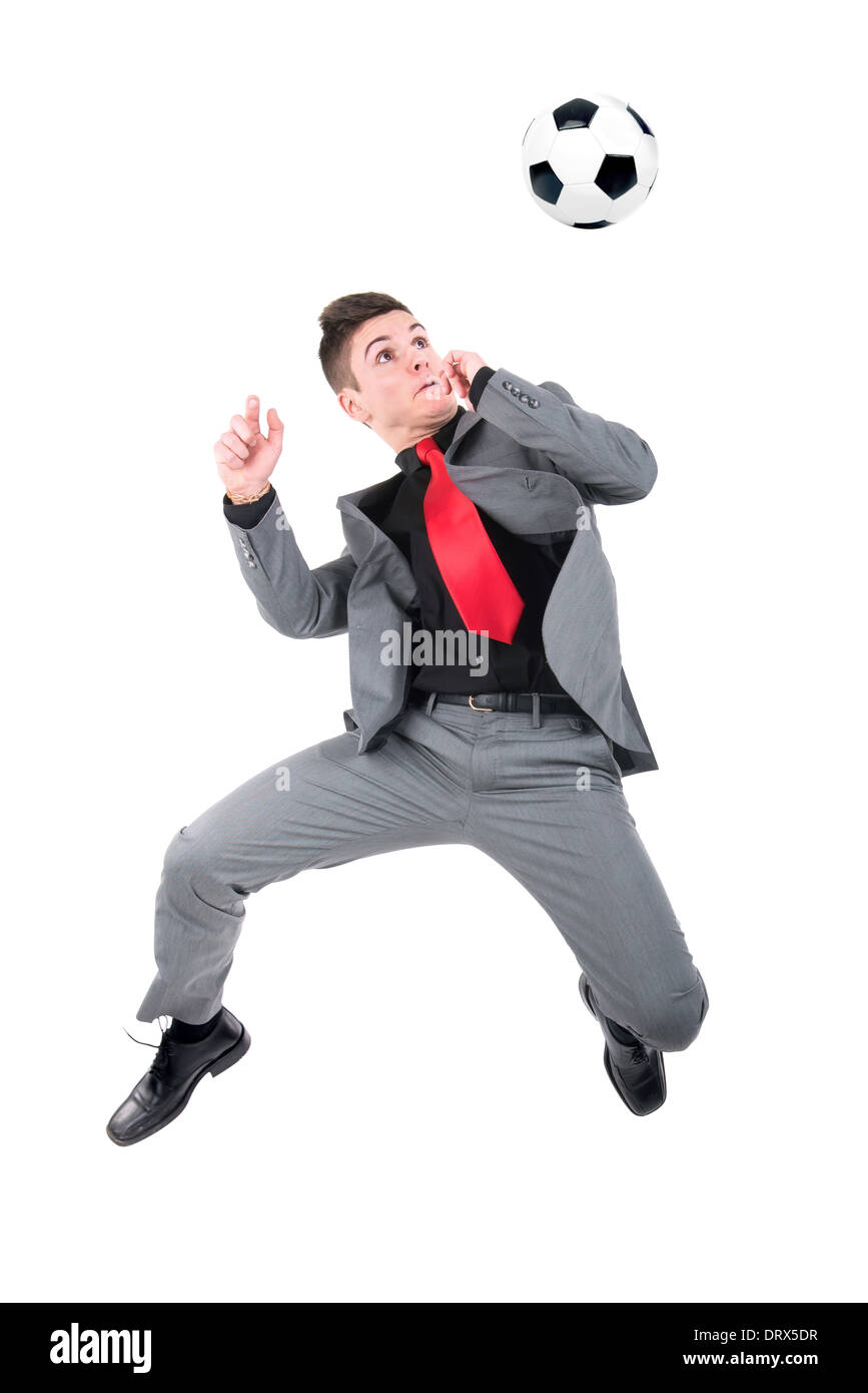 Businessman playing soccer ball isolated in white Stock Photo - Alamy