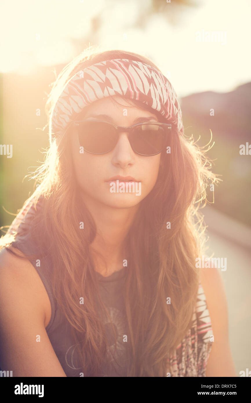 Fashion lifestyle, Beautiful young woman backlit at sunset Stock Photo