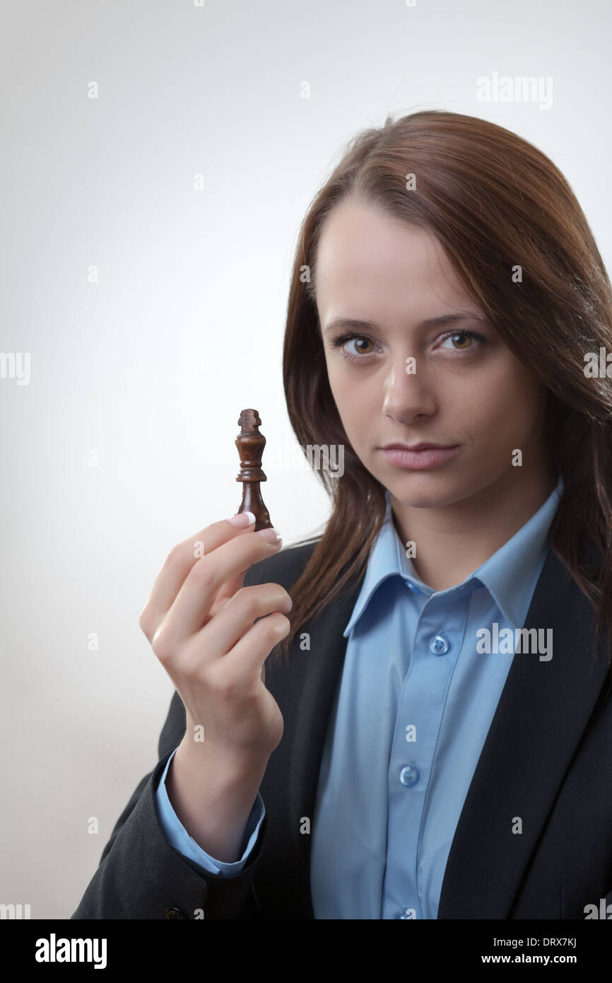 business woman planning her next move on a chess game  Stock Photo