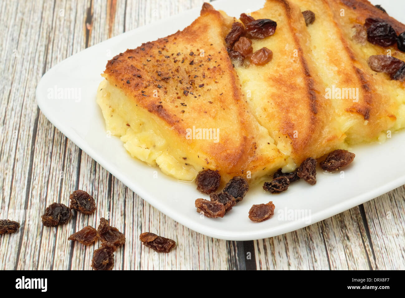Fresh baked bread and butter pudding studio shot Stock Photo Alamy