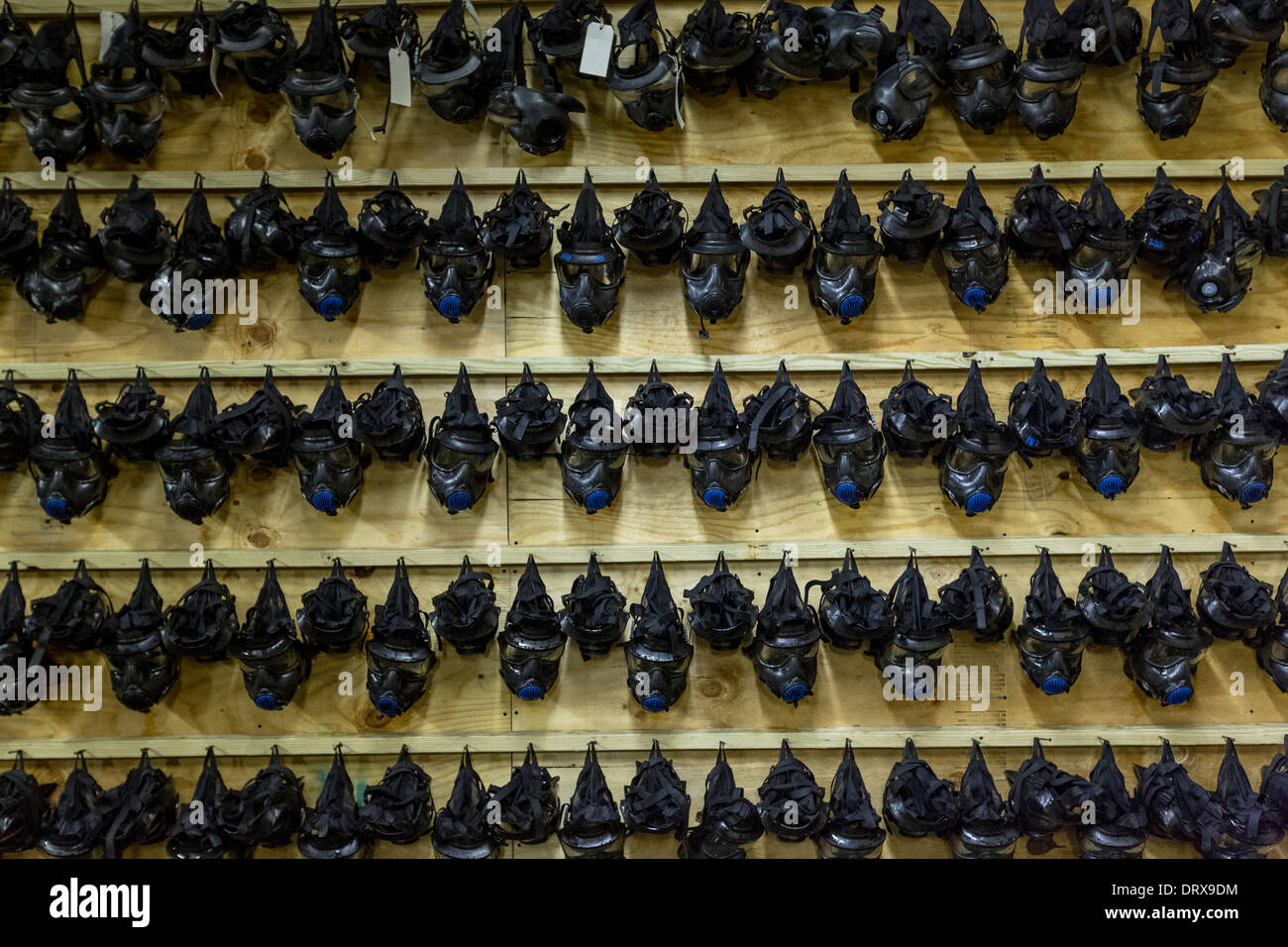 Gas masks hang from a wall at the gas training facility at the US Marine Corps Recruit Depot boot camp January 13, 2014 in Parris Island, SC. Stock Photo