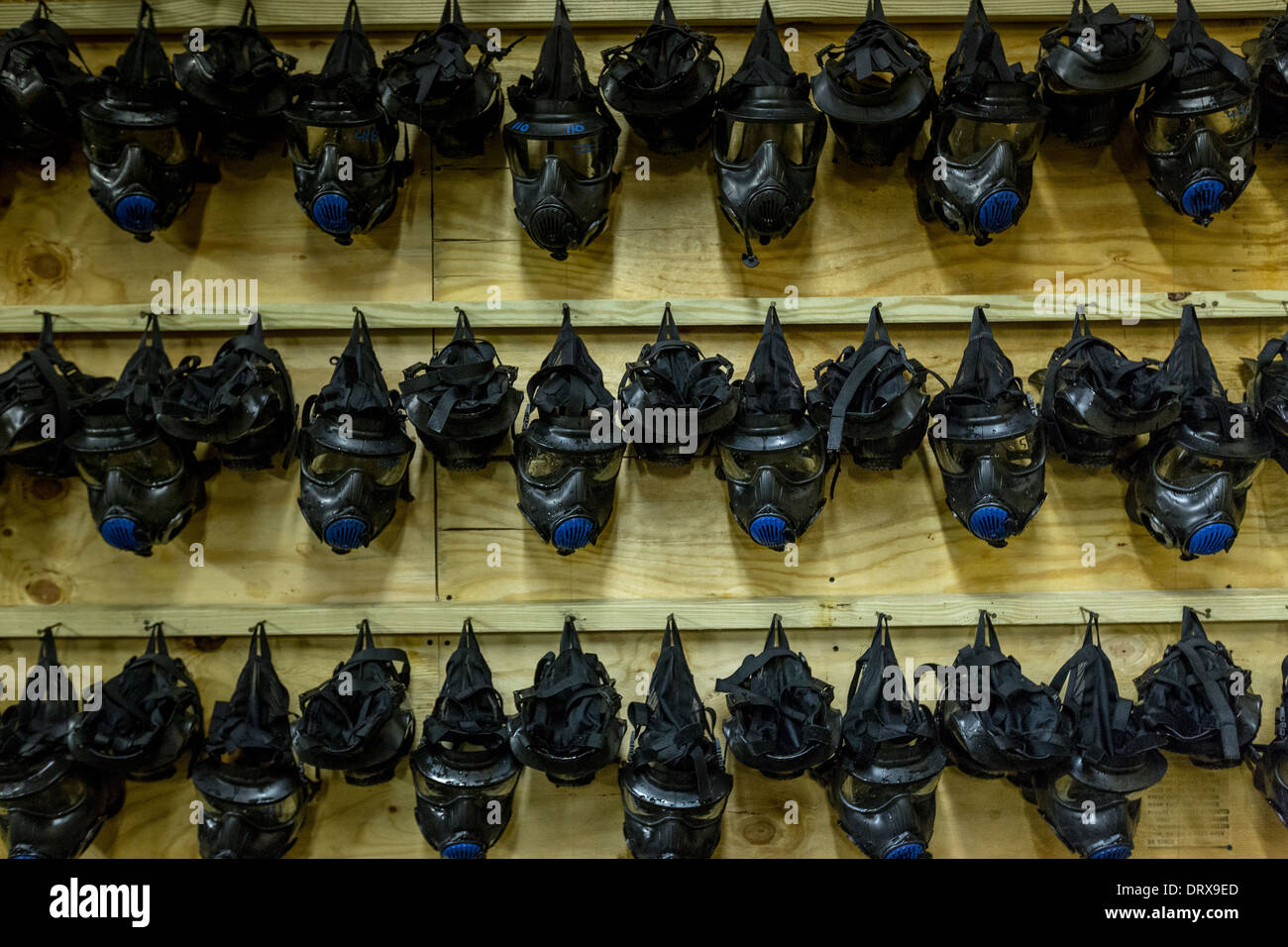 Gas masks hang from a wall at the gas training facility at the US Marine Corps Recruit Depot boot camp January 13, 2014 in Parris Island, SC. Stock Photo