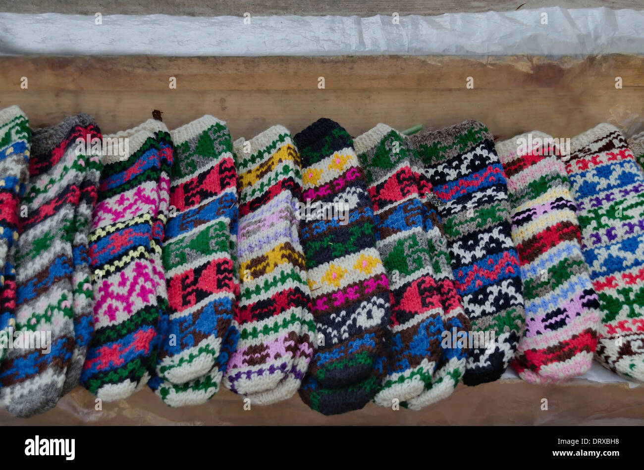 Traditional bulgarian colourful wool stocking knitted by hand Stock Photo