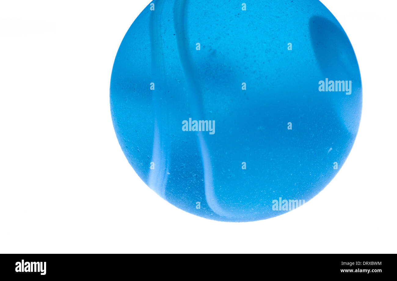 Macro, close up image of blue marble with white stripes on white