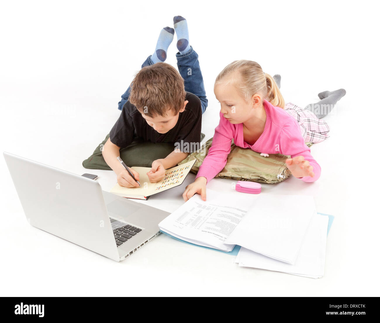 Child Boss and his child Secretary watching the Laptop and the statement Stock Photo
