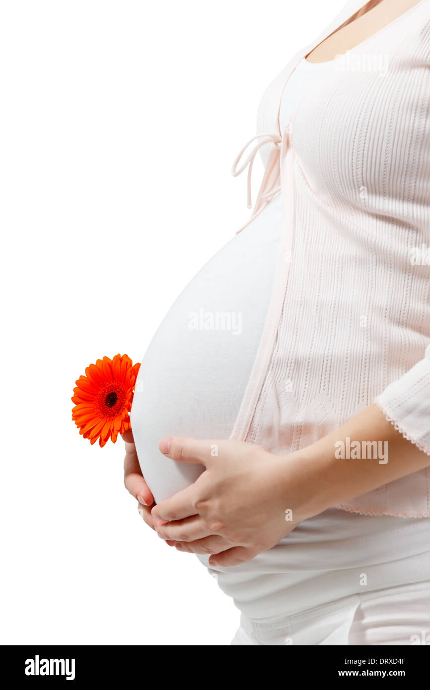 Pregnant woman touching her belly Stock Photo