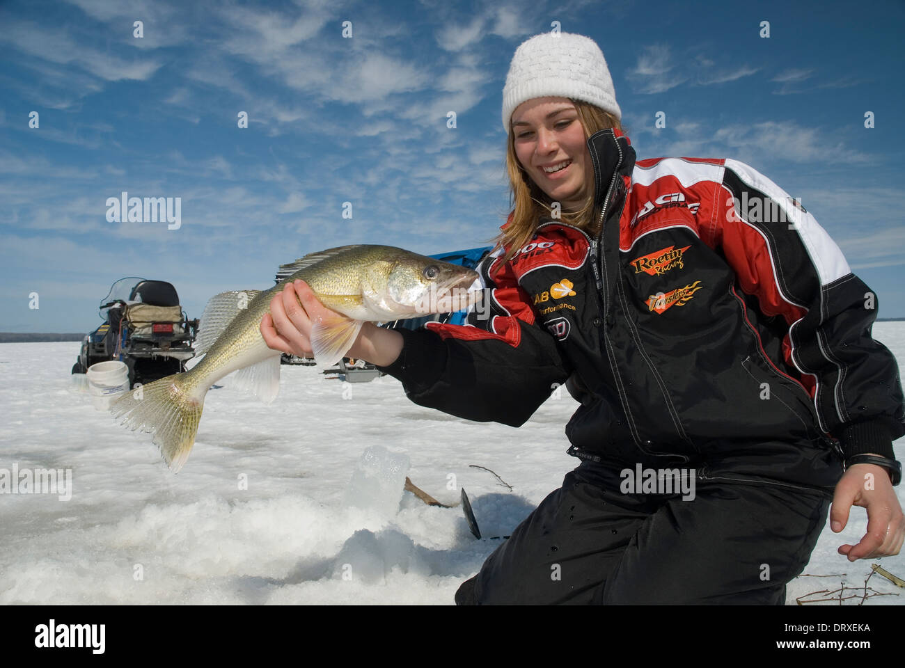 A young girl holds up a winter walleye she caught ice fishing Stock Photo -  Alamy