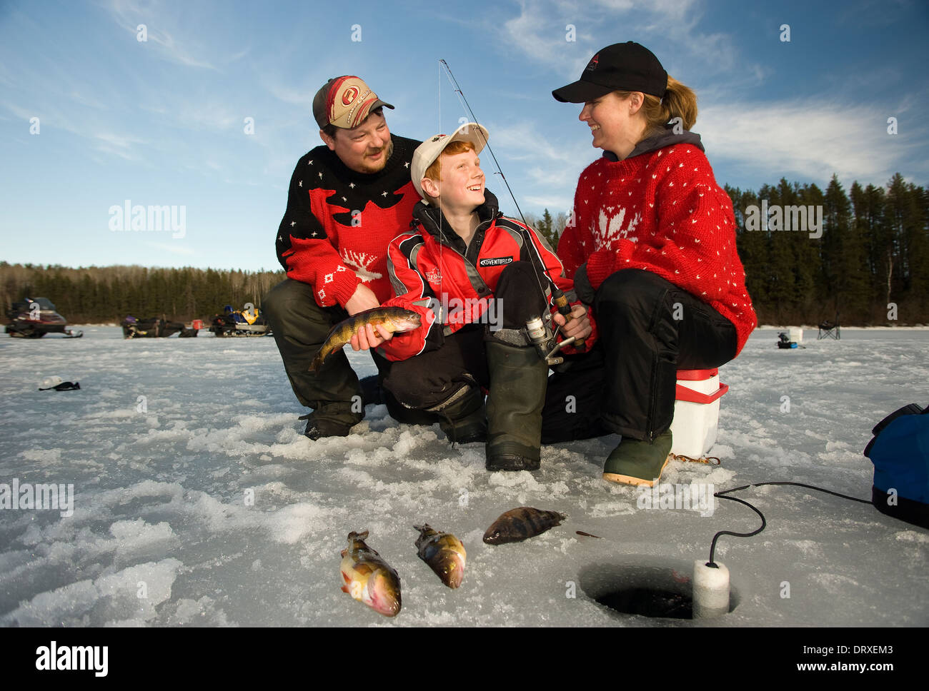 Woman holds up a winter walleye she caught ice fishing Stock Photo - Alamy