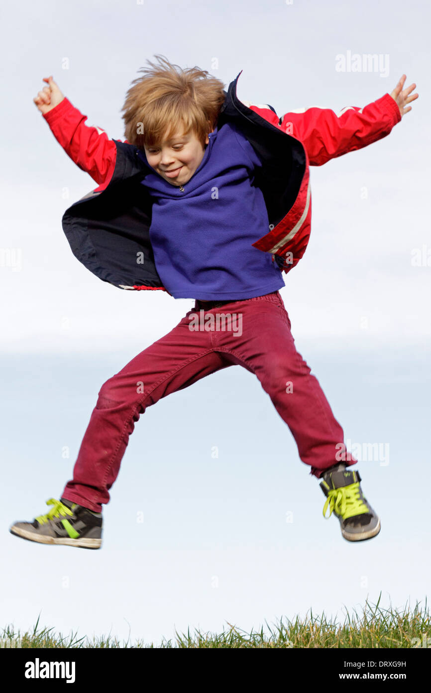 young boy jumping Stock Photo
