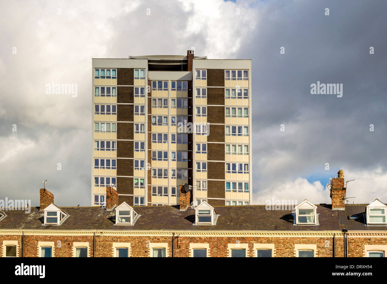 Traditional Victorian terraced houses of Falconar Street with the modern 1960's tower block flats behind. Newcastle Upon Tyne, UK. Stock Photo