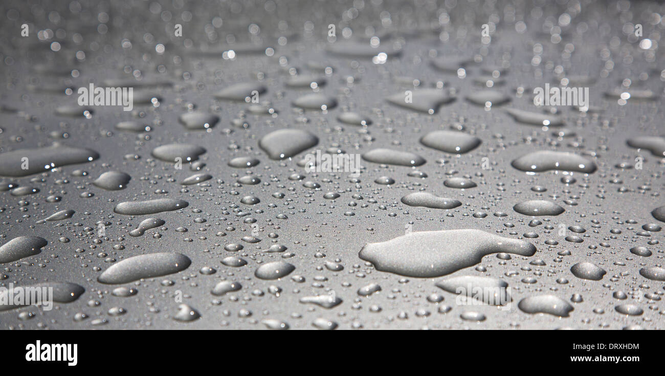 Water droplets on shiny metal surface Stock Photo