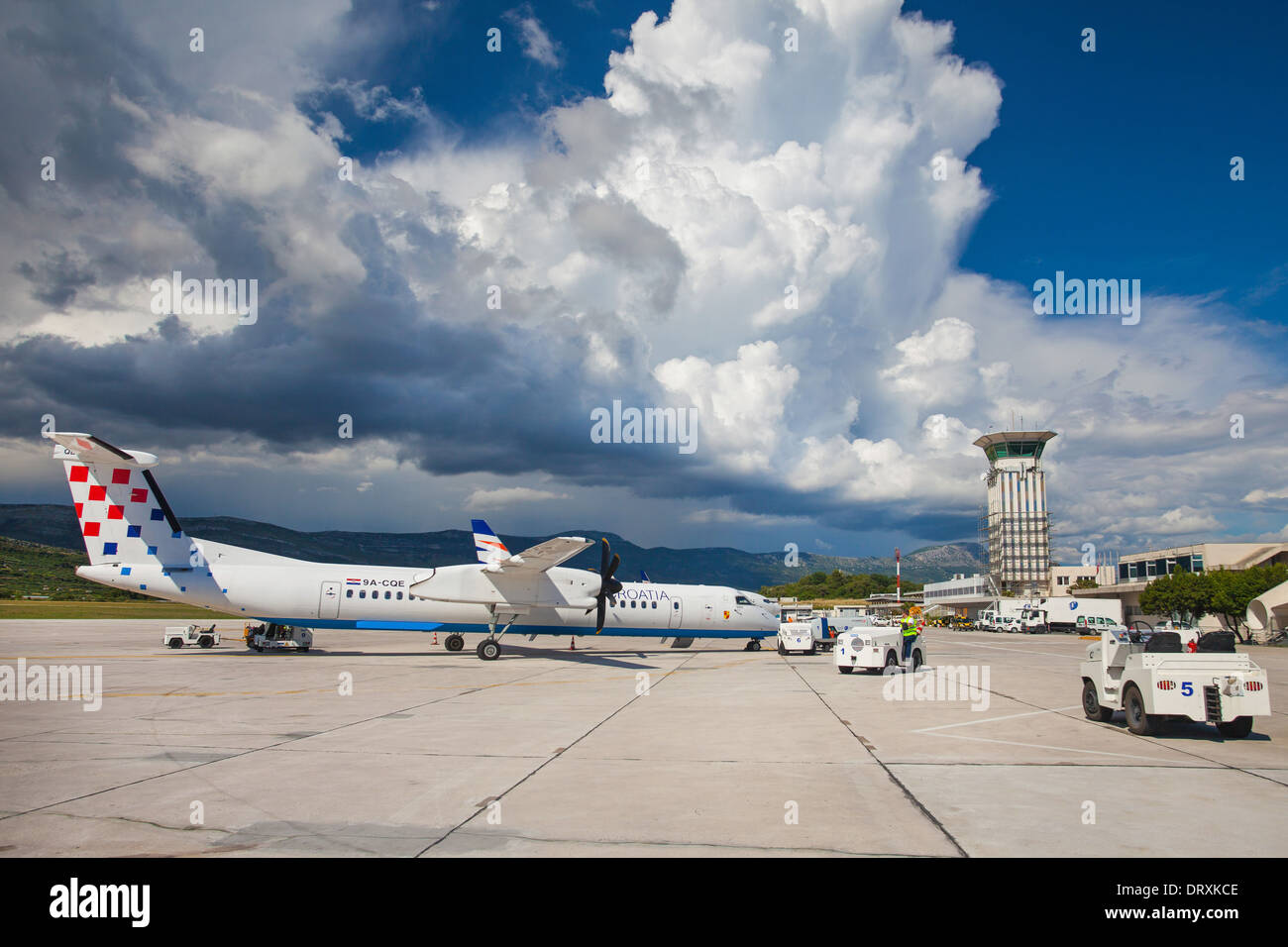 SPLIT, CROATIA - JUN 6: Croatia Airlines Dash 8 Q400 parked on a runway of Split Airport Stock Photo