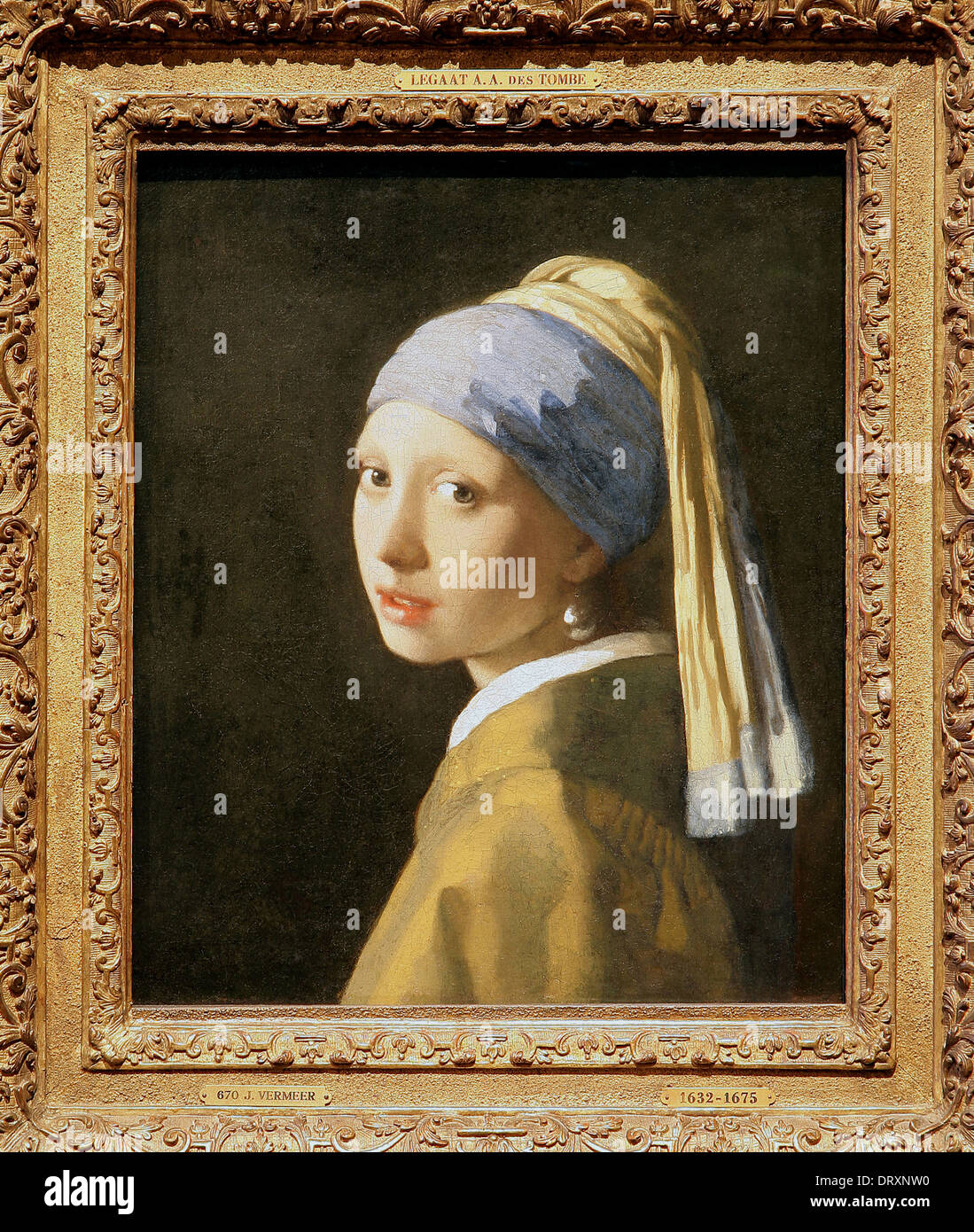 Girl with a Pearl Earring (1665) A ‘tronie by Dutch painter Johannes Vermeer  1632-1675. Vermeer’s most famous painting.Not a portrait,but a ‘tronie'. Stock Photo