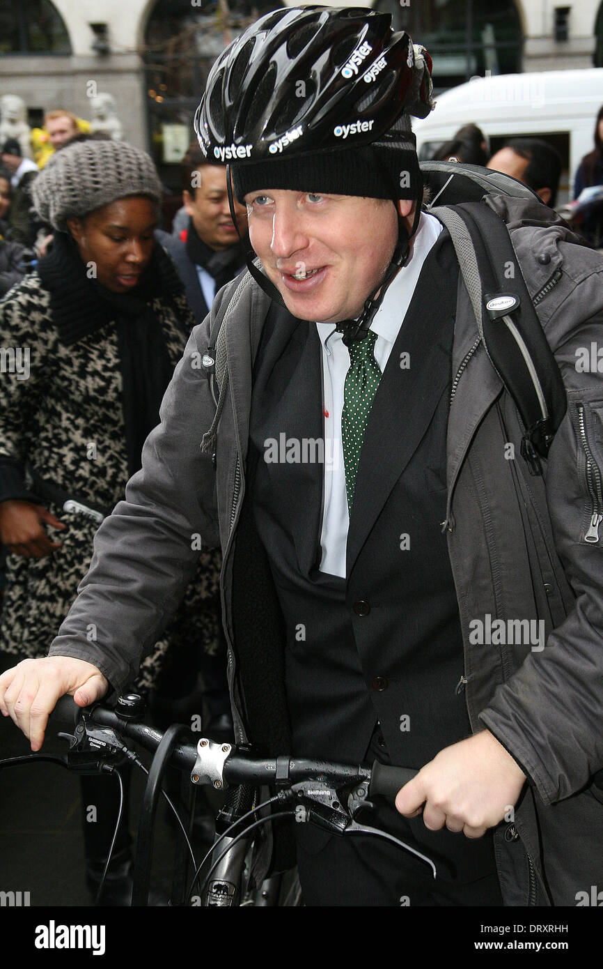 London Mayor Boris Jonson on his bike in London with Oyster advertising on helmet Stock Photo