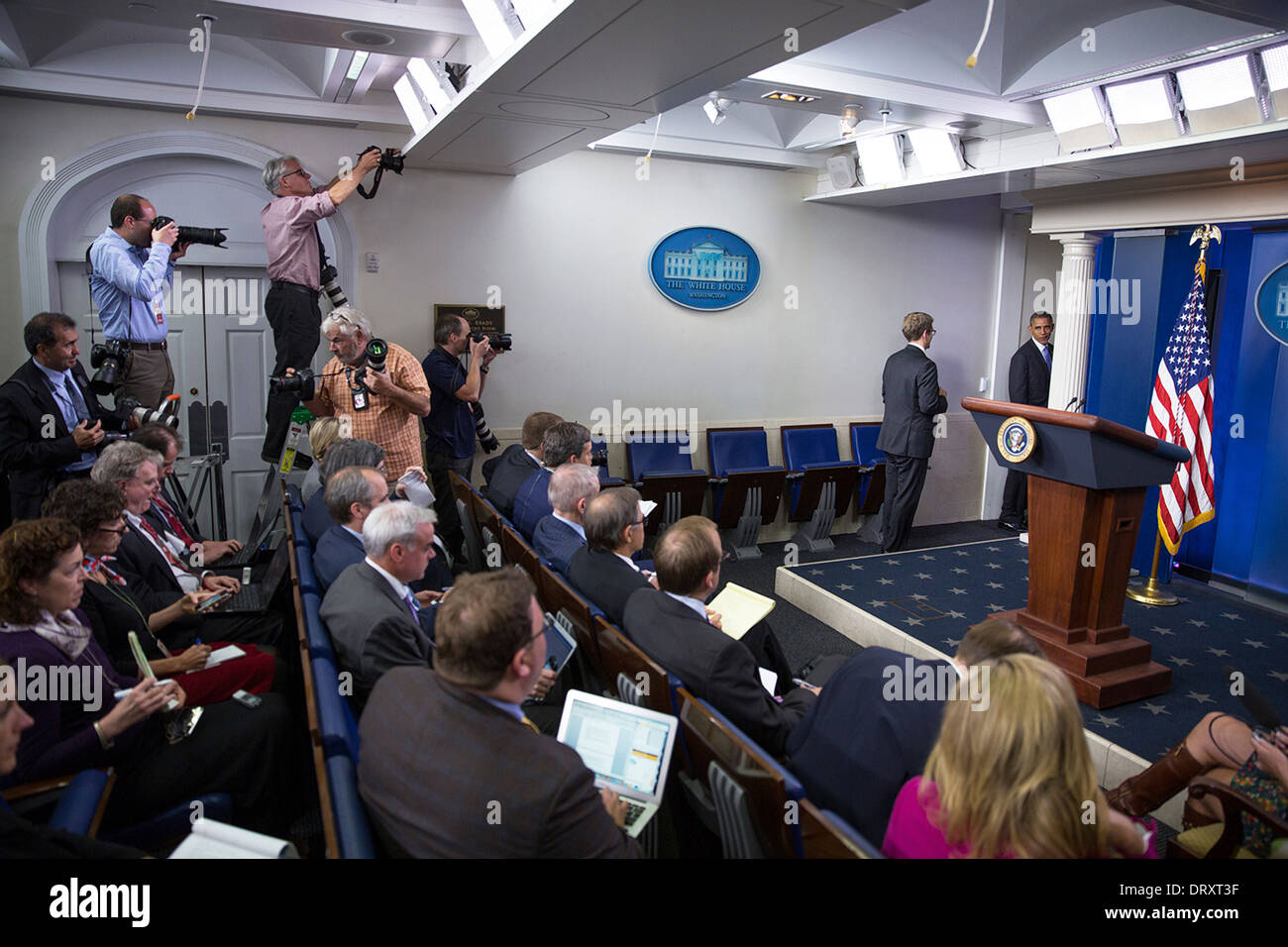 US President Barack Obama departs the James S. Brady Press Briefing Room after delivering a statement on the federal government shutdown in the White House October 16, 2013 in Washington, DC. Stock Photo