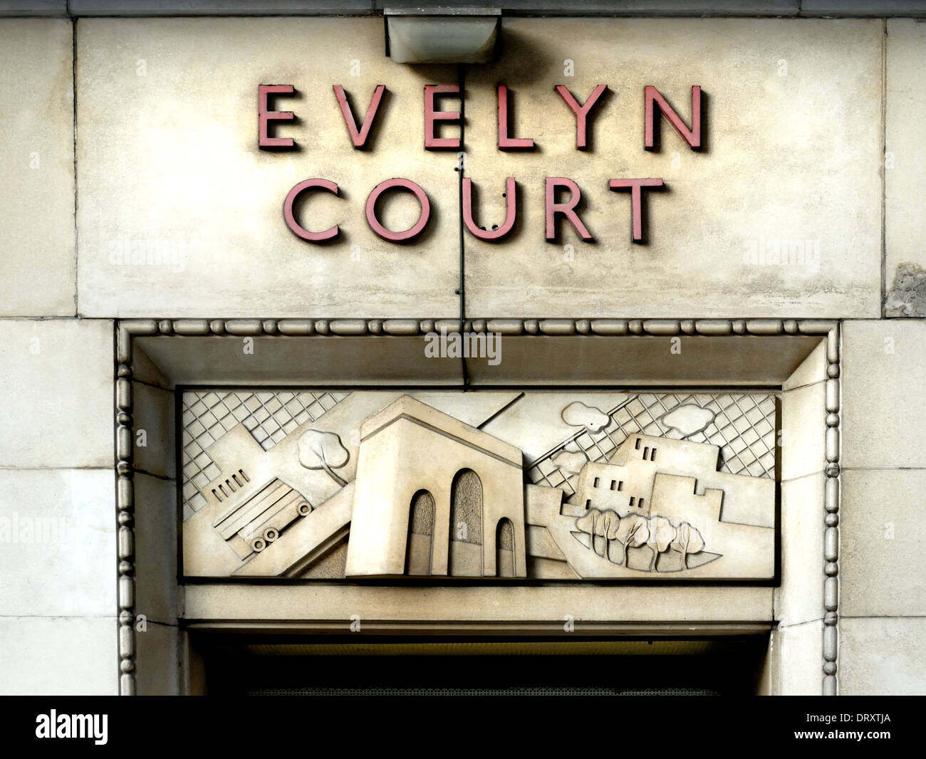 London, England, UK. Art Deco detail above the door of Evelyn Court in