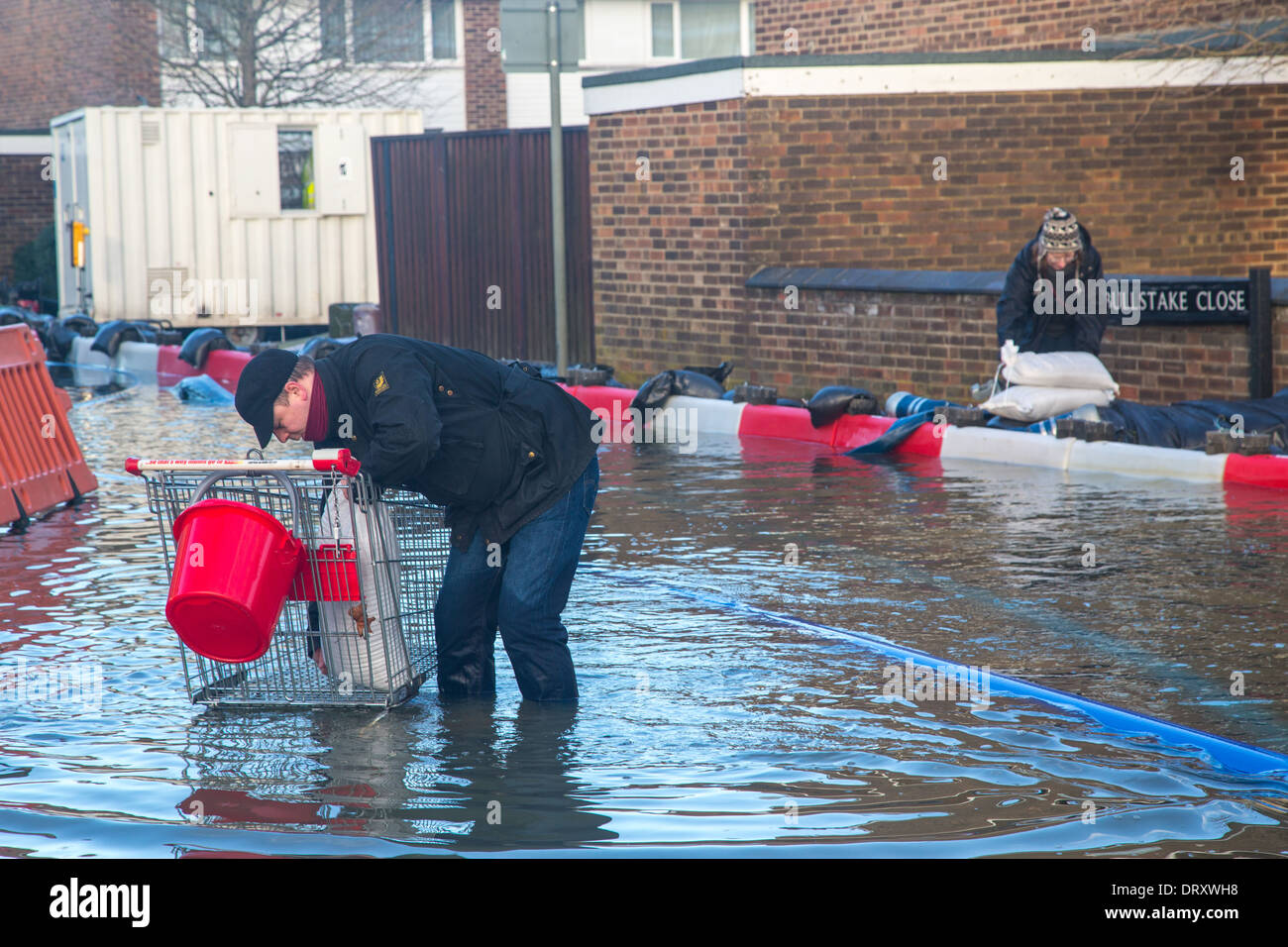 A Man fetches Sandbags during the Floods, Botley Road, Oxford, January 2014 Stock Photo