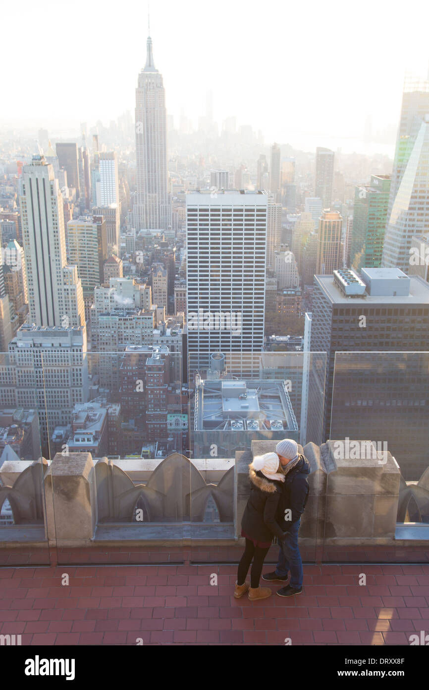 A Couple kiss on Top of the Rock, Rockefeller Center, NYC Stock Photo