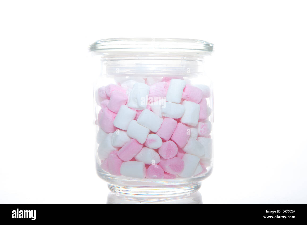 Glass jar of pink and white Marshmallow isolated on white Stock Photo