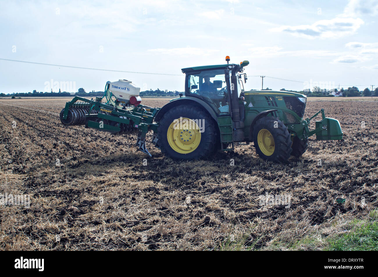 John Deere tractor with harrow turning at field end Stock Photo - Alamy