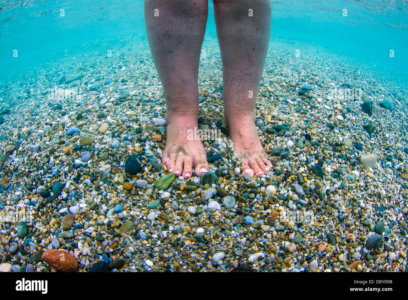 Underwater photo of a feet in the sea Stock Photo