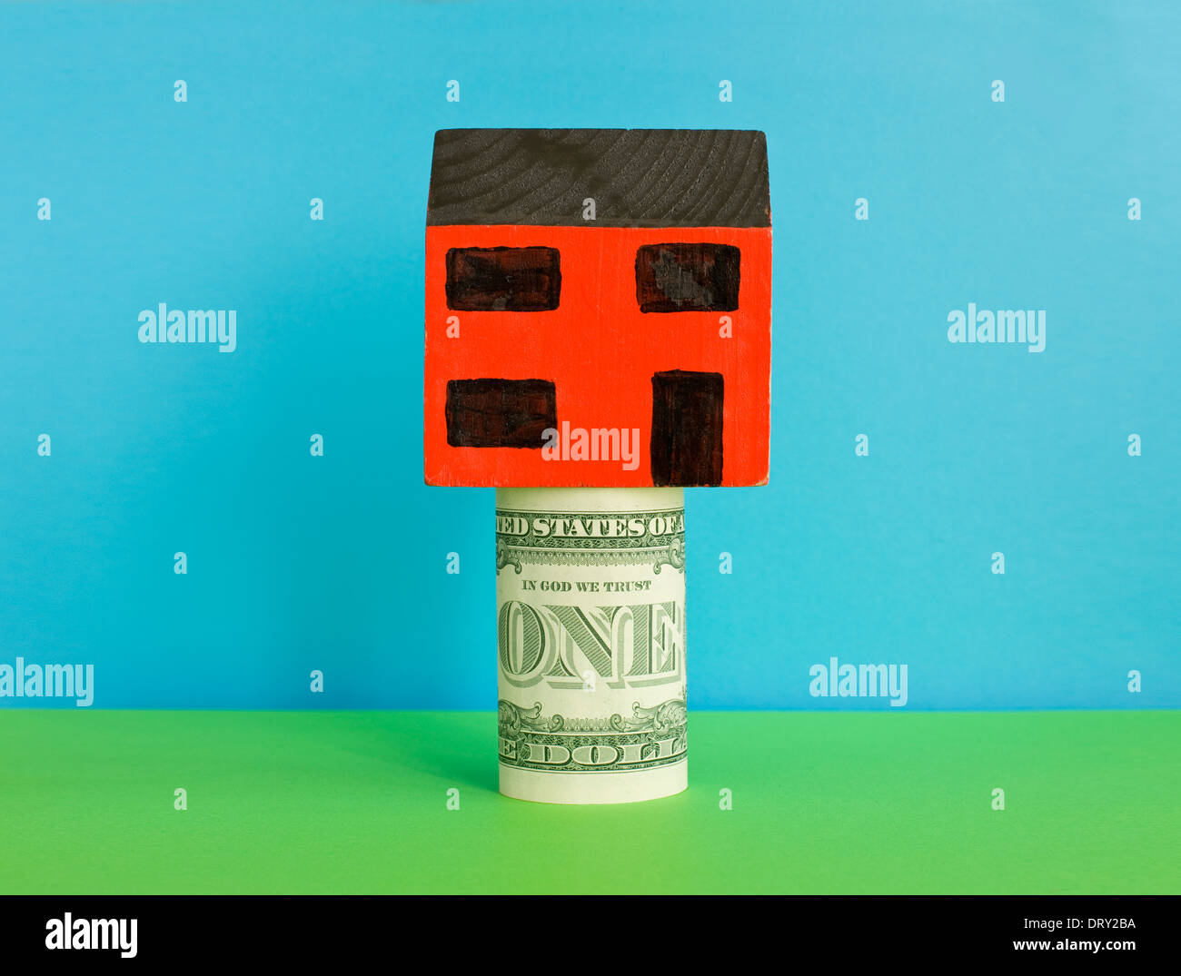 Toy house on one dollar bill Stock Photo