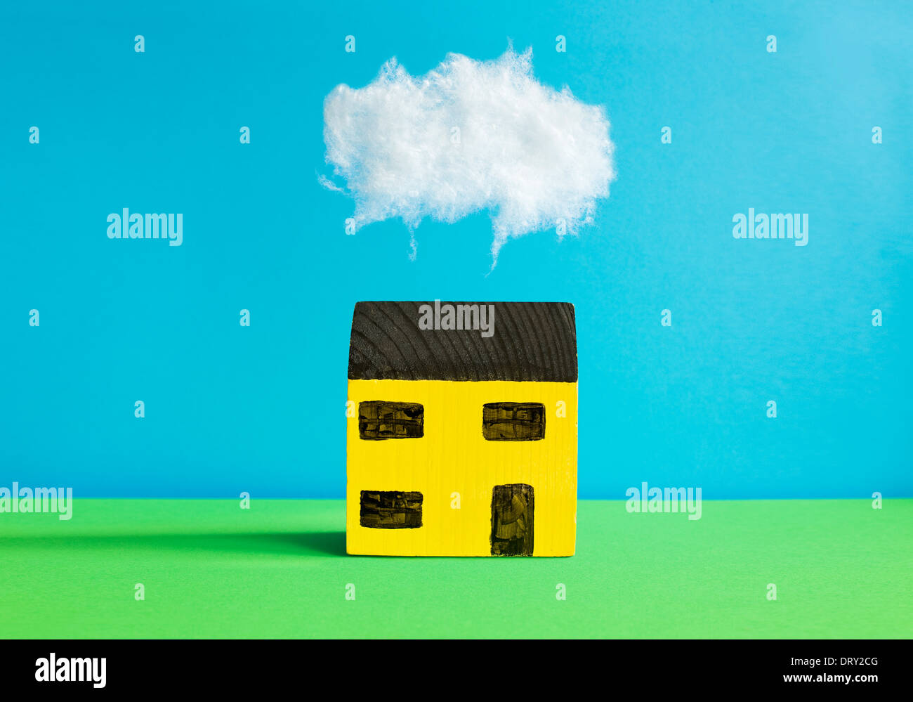 Toy house with cloud Stock Photo