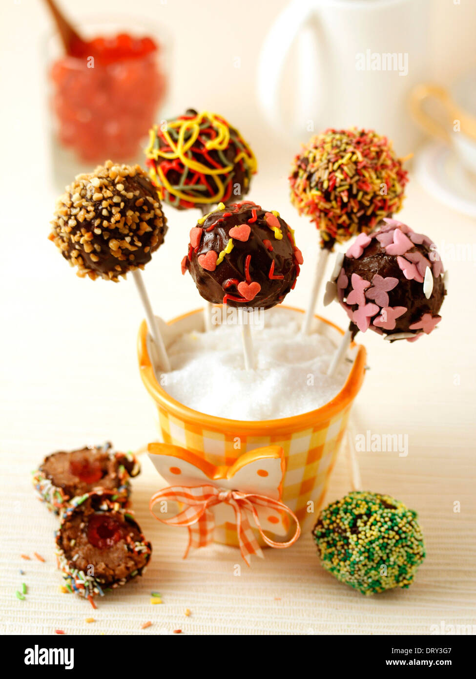 Chocolate cake pops with cherries. Recipe available. Stock Photo