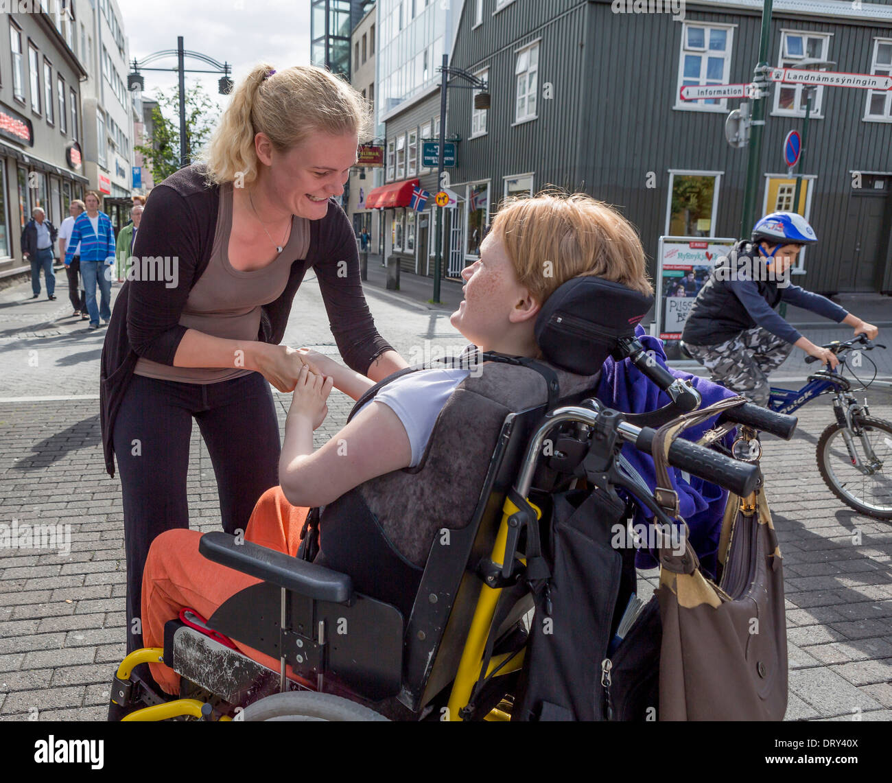 Caregiver with disabled girl. Reykjavik, Iceland Stock Photo